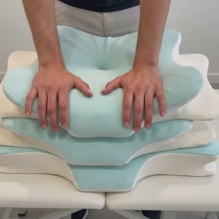 Hands press the Sleepsake Butterfly Pillow: soft like a cloud, then it springs back to hold you